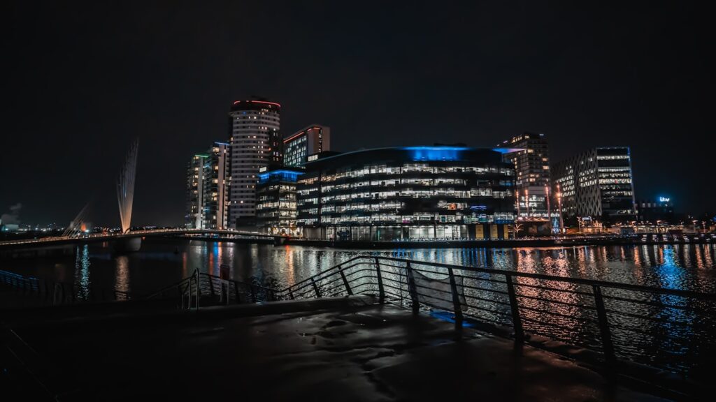 MediaCity Salford Quays at night - property investment opportunities North West UK